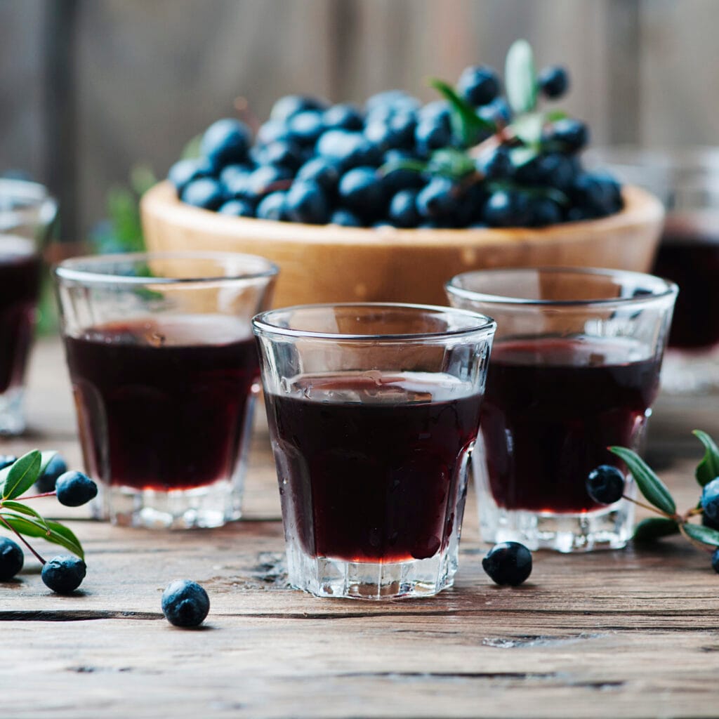 Traditional sardinian liqueur with mirto, selective focus and square image